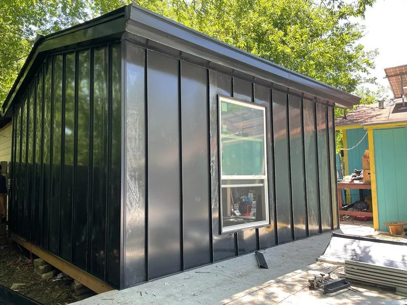 Black standing seam metal wall panels for Metal Roof Installation in University of Virginia