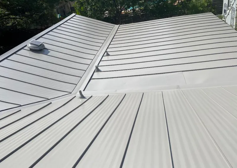 Solar attic fan installed on a metal roof for Roof Ventilation in University of Virginia